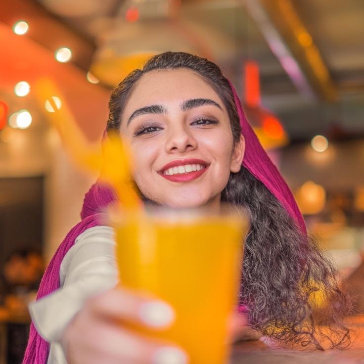 Maya Singh, Lead Design Curator at Craft Loft Gallery, reviewing corporate floral arrangements